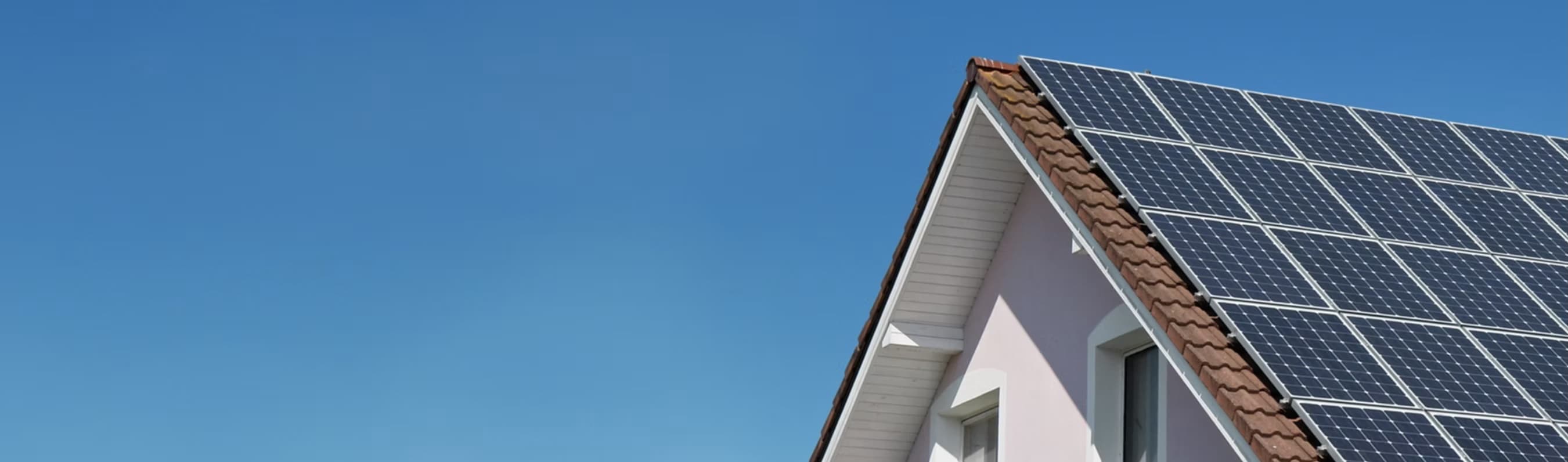 California-style home with rooftop solar at sunset